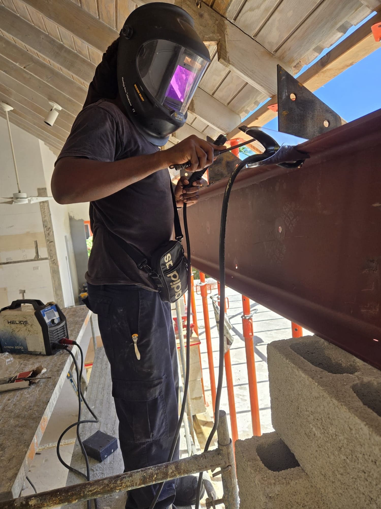 Stick-welding a steel I-beam on site